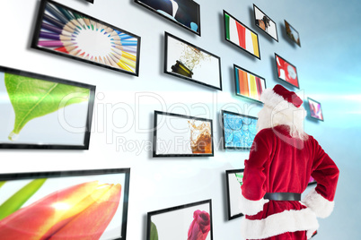 Composite image of santa looks away from the camera