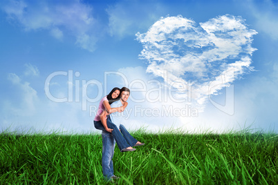 Composite image of young man giving girlfriend a piggyback ride