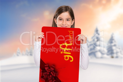 Composite image of cute little girl showing card