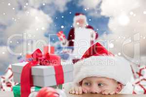 Composite image of cute boy looking at gifts