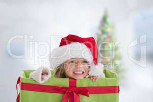 Composite image of cute girl in large gift