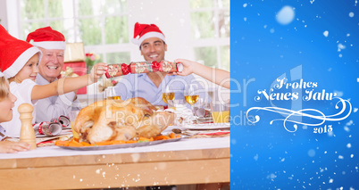 Composite image of siblings pulling a christmas cracker