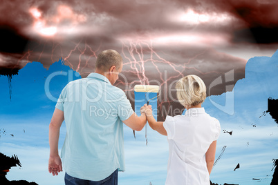 Composite image of happy older couple painting