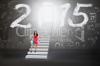 Composite image of woman standing with shopping bags