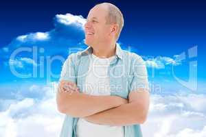 Composite image of happy older man with arms crossed