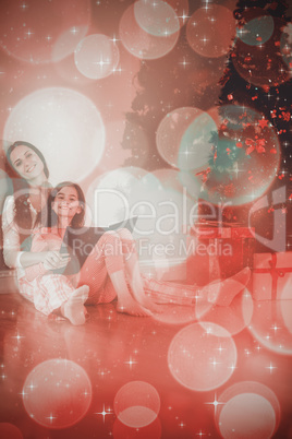 Composite image of mother and daughter waiting for santa claus