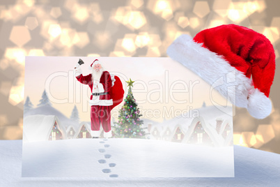 Composite image of santa delivery presents to village