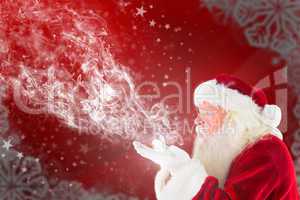 Composite image of santa claus blows something away