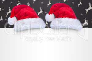 Composite image of santa hat on poster