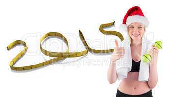 Composite image of festive fit blonde smiling at camera