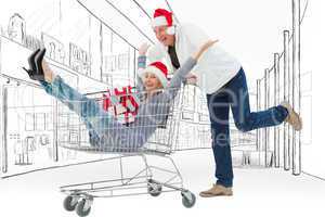 Composite image of man pushing wife in trolley with gifts