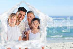 Composite image of portrait of a cute family at the beach