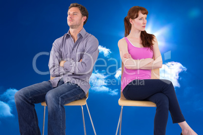 Composite image of sitting couple ignoring each other Composite image of sitting couple ignoring each other