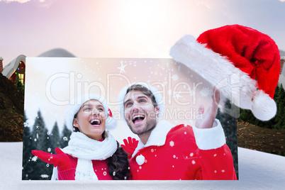 Composite image of festive young couple