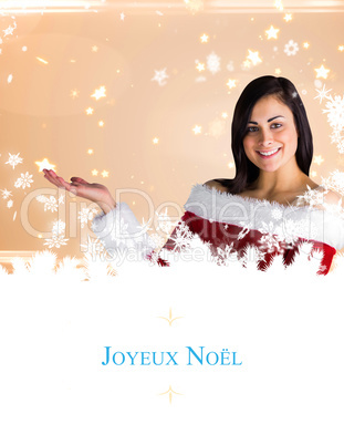 Composite image of pretty girl presenting in santa outfit