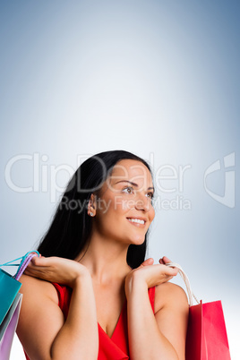 Woman standing with shopping bags