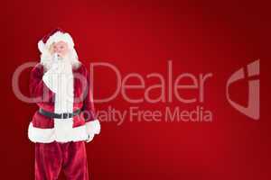 Composite image of santa asking for quiet to camera