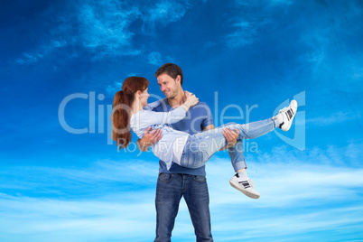 Composite image of man lifting up his girlfriend