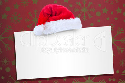 Composite image of santa hat on poster