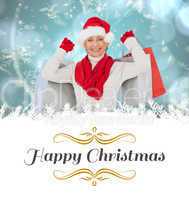 Composite image of festive woman holding shopping bags