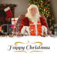 Composite image of santa claus offering a red gift