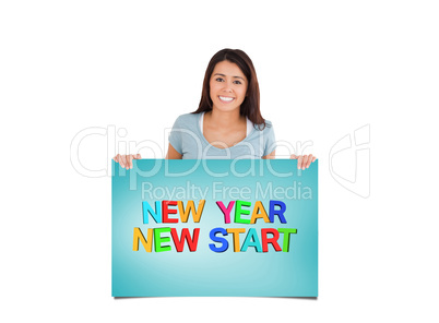 Composite image of attractive woman holding a  board