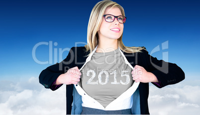 Composite image of businesswoman opening shirt in superhero styl