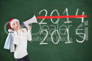 Composite image of festive blonde holding gift bags and megaphon