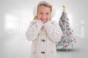 Composite image of cute girl in ear muffs