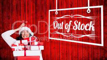 Composite image of shocked woman with christmas presents