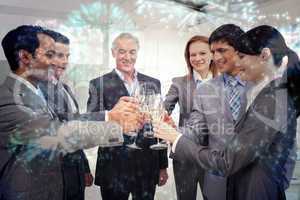 Composite image of cheerful business team toasting with champagn