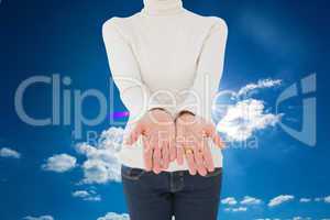 Composite image of woman standing with her hands out