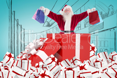 Composite image of santa standing in large gift