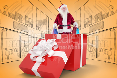 Composite image of santa standing in large gift