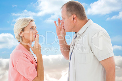 Composite image of older couple holding hands to mouth for silen