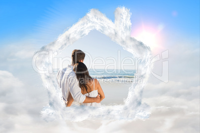 Composite image of content couple looking at the waves