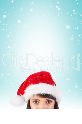 Close up portrait of pretty woman in santa hat