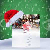 Composite image of santa hat on poster