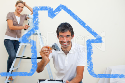 Composite image of smiling couple painting a wall