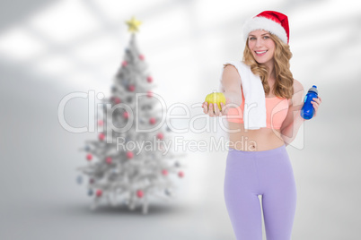 Composite image of festive fit blonde smiling at camera