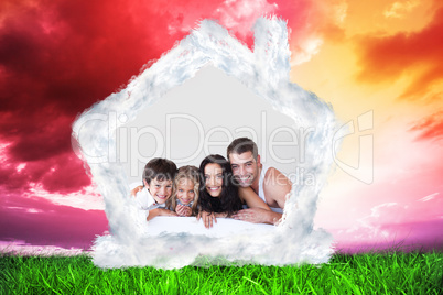 Composite image of lovely family lying on their bed