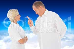 Composite image of angry man pointing at his partner