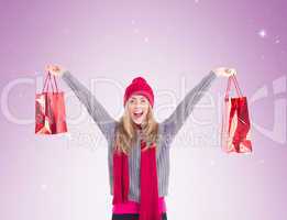 Festive blonde holding shopping bags