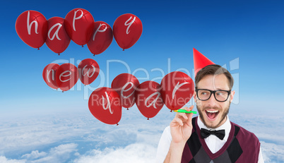 Composite image of geeky hipster in party hat with horn