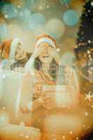 Composite image of daughter surprising her mother with christmas