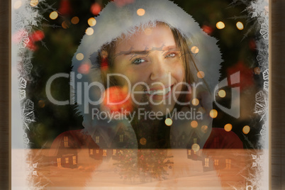 Composite image of sexy santa girl smiling at camera