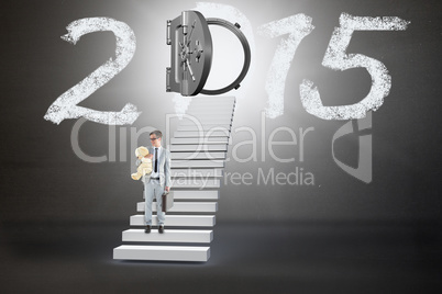 Composite image of businessman holding teddy bear