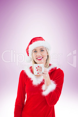 Festive blonde holding a mug