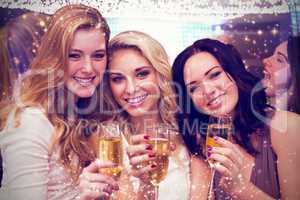 Composite image of pretty friends drinking champagne together