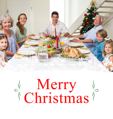 Composite image of family having christmas meal together